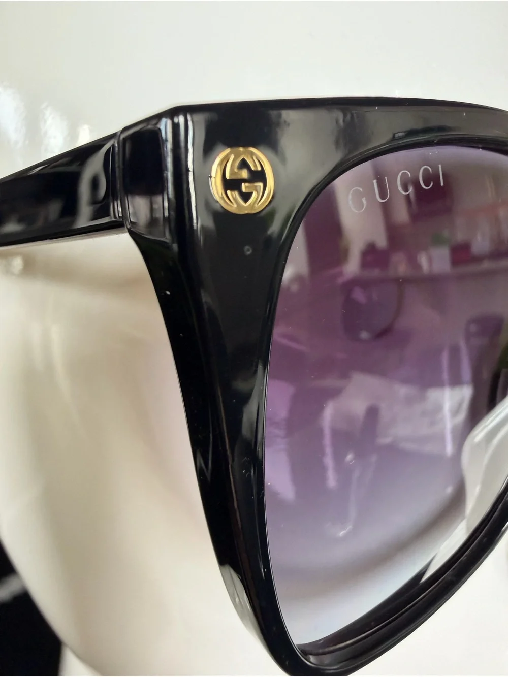 Gucci Black Frame Sunglasses with Gradient Purple Lenses